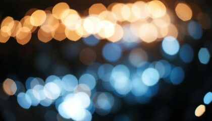 Naklejka premium Abstract Glowing Background with Golden and Blue Bokeh in the Darkness, Representing Magic and Light Effects – Christmas, Holiday Season, December-January