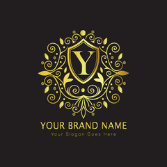 Letter Luxury brand logo design with a royal gold crown emblem and elegant typography
