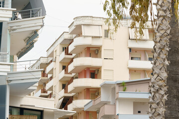 Modern apartment building in Mediterranean style in Albania on the sea coast. Concept of selling a...