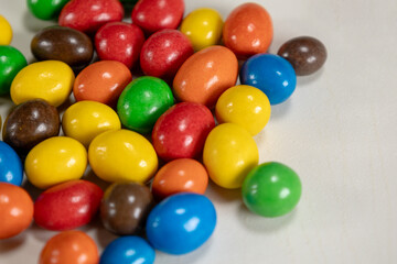 Multicoloured button-shaped chocolates. Concept: Sweets, chocolate, candies.