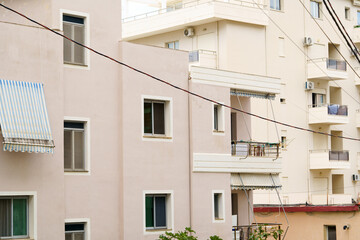 Modern apartment building in Mediterranean style in Albania on the sea coast. Concept of selling a house abroad, renting apartments