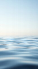 Vertical ocean water surface with a hazy mist, creating a serene and mysterious seascape. Perfect for nature, tranquility, and atmospheric backgrounds.	
