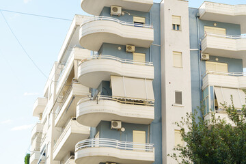 Vertical image modern apartment building in Mediterranean style in Albania on the sea coast....