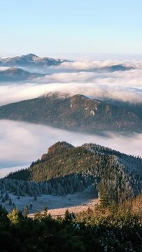 timelapse of foggy clouds moving in alps valley at