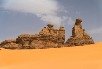 Sandstone rock formations and dunes in the Algerian desert