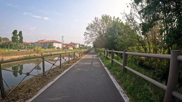 bicycle path near Badile (Zibido San Giacomo) along the Naviglio Pavese canal between Pavia and Milan, Lombardy, Italy