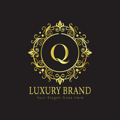 Letter Luxury brand logo design with a royal gold crown emblem and elegant typography
