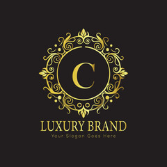 Letter Luxury brand logo design with a royal gold crown emblem and elegant typography
