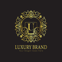 Letter Luxury brand logo design with a royal gold crown emblem and elegant typography
