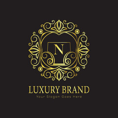 Letter Luxury brand logo design with a royal gold crown emblem and elegant typography
