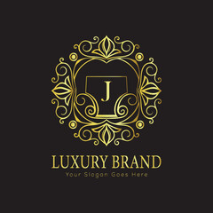 Letter Luxury brand logo design with a royal gold crown emblem and elegant typography
