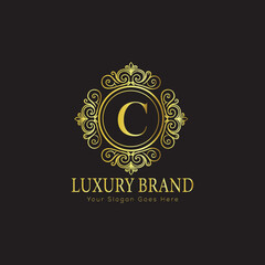 Letter Luxury brand logo design with a royal gold crown emblem and elegant typography
