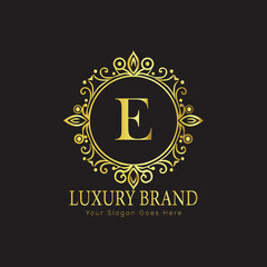 Letter Luxury brand logo design with a royal gold crown emblem and elegant typography
