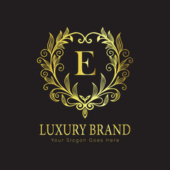 Letter Luxury brand logo design with a royal gold crown emblem and elegant typography
