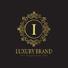 Letter Luxury brand logo design with a royal gold crown emblem and elegant typography
