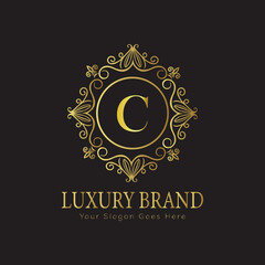 Letter Luxury brand logo design with a royal gold crown emblem and elegant typography
