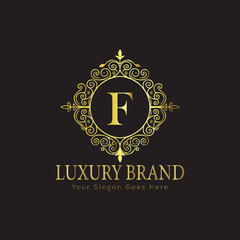 Letter Luxury brand logo design with a royal gold crown emblem and elegant typography
