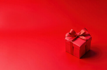 Red Gift Box with Red Bow and Red Ribbon on Red Background concept for Valentine