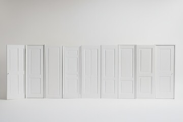various styles of white interior doors against a white background