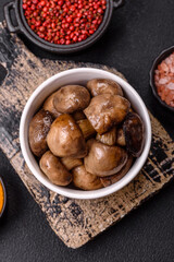 Grilled champignon mushrooms with salt, spices and herbs