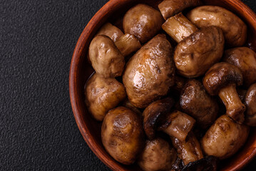 Grilled champignon mushrooms with salt, spices and herbs