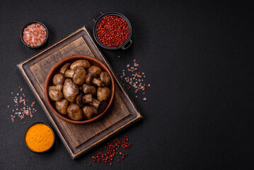 Grilled champignon mushrooms with salt, spices and herbs