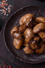 Grilled champignon mushrooms with salt, spices and herbs
