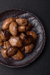 Grilled champignon mushrooms with salt, spices and herbs