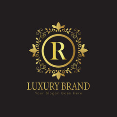 Fototapeta premium Letter Luxury brand logo design with a royal gold crown emblem and elegant typography