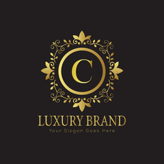 Letter luxury gold logo concept brand logo design with a royal gold crown emblem and elegant typography
