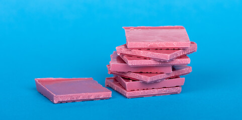 stack of ruby chocolate on blue background