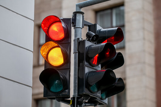 Close up of black traffic light for cars and pedestrians with stop red signal for stoping