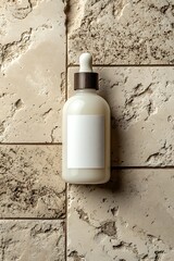 Glass bottles with blank labels on a rough surface, ideal for capturing product images.