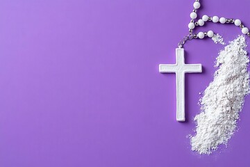 The concept of Ash Wednesday displayed on a violet fabric with a rosary