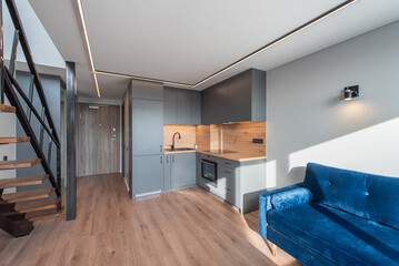 Modern Loft Open-Plan Apartment Interior With Wooden Flooring and and Wooden Staircase Design. Modern Home Living Room Interior.