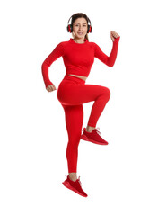 Woman in sportswear and headphones exercising on white background