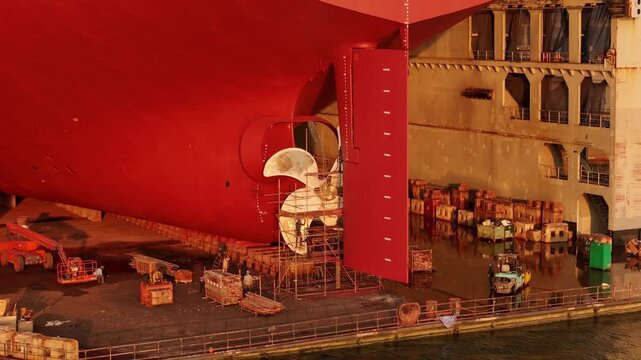 Propeller of large ship spinning power working and water splash contrail . Close up image detail Stern back of Vessel ship, Logistics Transportation industry express technology Freight.