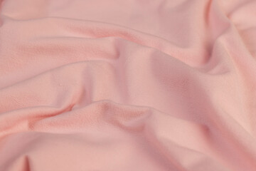 details of a part of the pink fabric that is used to make clothes