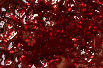Crumpled sweet raspberries with added sugar