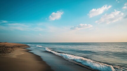 Obraz premium Serene Coastal Sunset: Tranquil Beach Scene