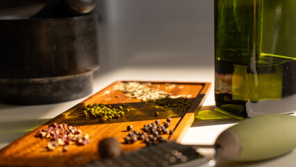 Variety of dried spices assorted on a rustic wooden plate