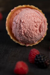 pink creamy raspberry flavored ice cream with red raspberry berries