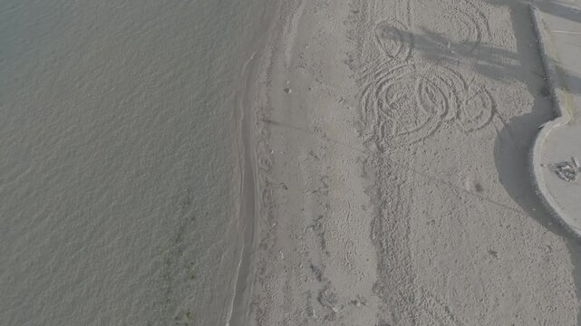 D Log - Sea waves hitting the beach - high quality D Log beach and sea video shot with drone