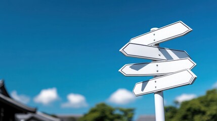 A clear sky serves as the backdrop for a directional signpost, indicating various routes and exploring new destinations.