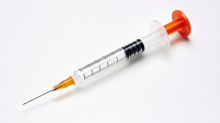 Fototapeta premium Medical Syringe on White Background: A Close-Up Shot