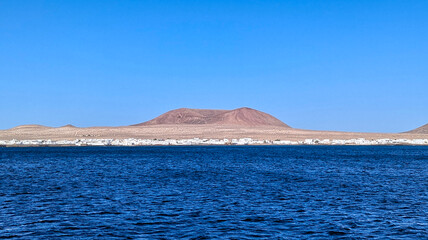 Caleta del Sebo village seen from the sea, La Graciosa Island, Canary islands, Spain