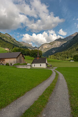 Fototapeta premium Switzerland landscape. Switzerland Alps. Alpine pasture in mountains. Mountains in the Swiss Alps. Panoramic view. Landscape with mountains in Switzerland. Switzerland Mountains. Rural landscape.