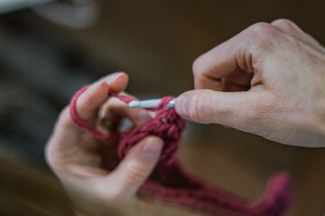 Crocheting during artistic handmade workshop. Close up 