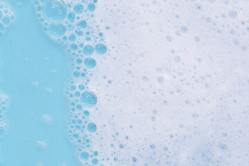 Detergent foam bubble on water. Blue background, Soap sud