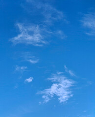 fluffy white clouds on the blue sky